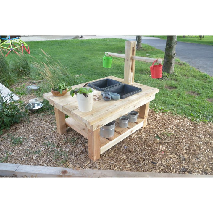 Side view of the ONP Large Explorer Table with Weigh Scale showing the Western Red Cedar frame, integrated wooden balance scale, galvanized sink, and lower storage shelf for outdoor STEM and sensory discovery play