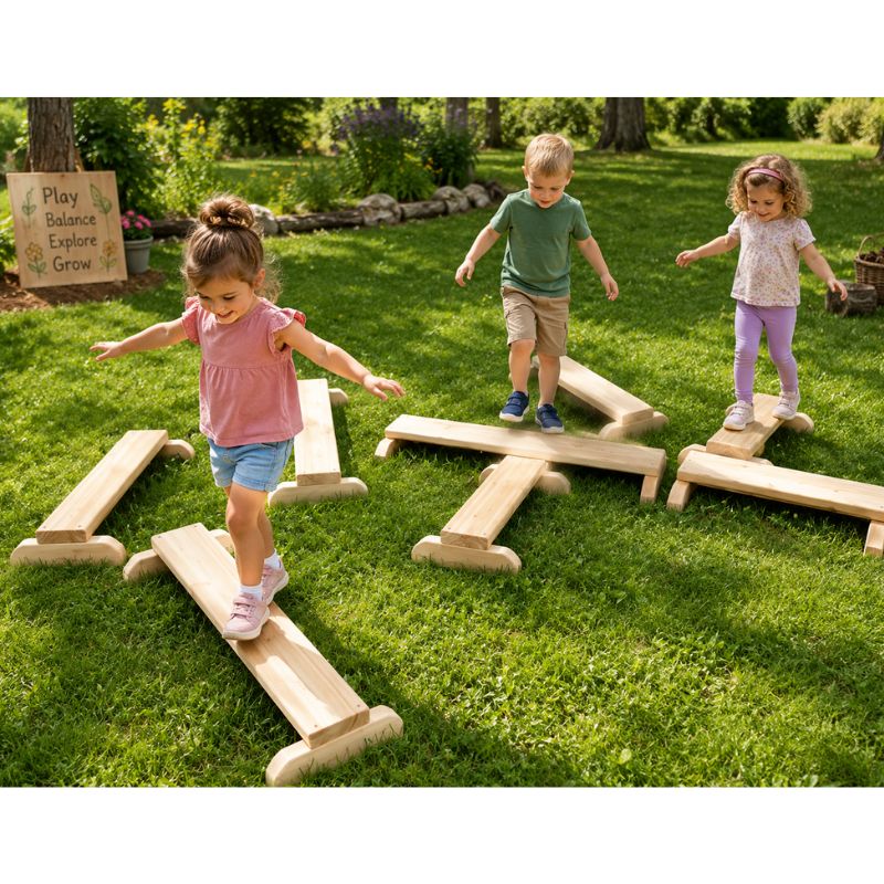 Three children walking across the ONP Gross Motor Boards outdoors, balancing on interlocking wooden boards arranged on the lawn