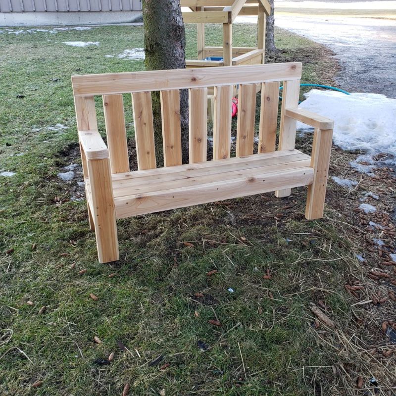 ONP Infant Buddy Bench outdoor view showing the full North American Cedar construction, 48-inch length, and taller armrests of this cedar outdoor infant bench designed for infant rooms and early years outdoor play spaces