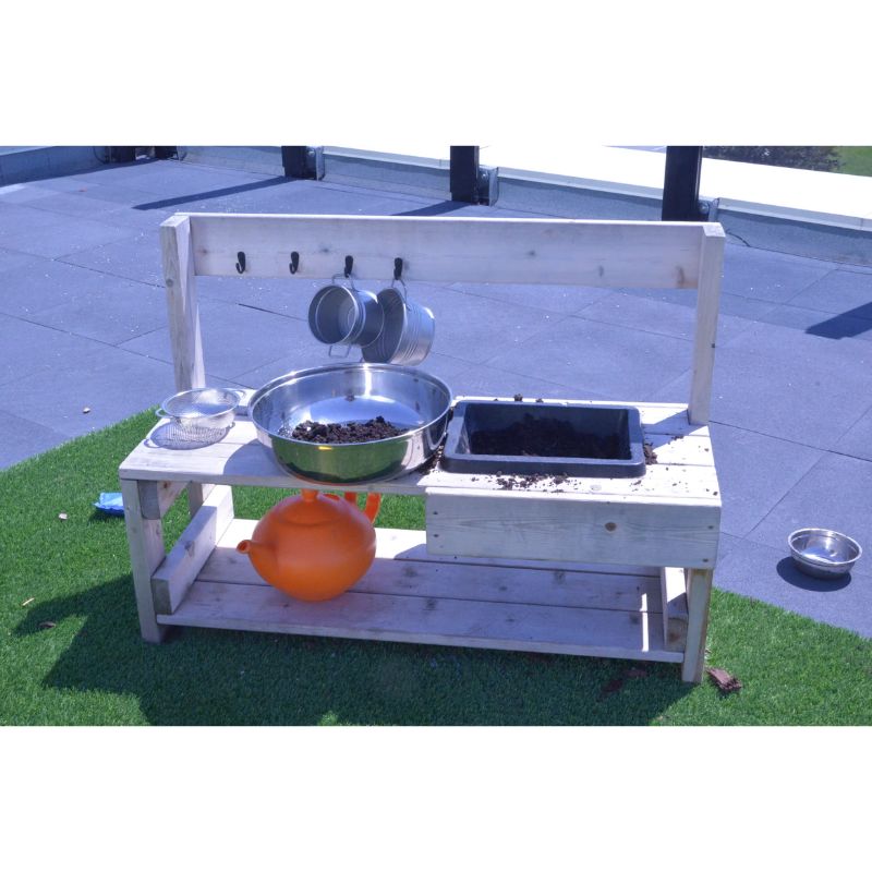 ONP Infant Mud Kitchen in active outdoor use showing the flexible rubber sink filled with mud, demonstrating the low-height cedar outdoor sensory kitchen for infant and toddler messy play across Canada and the US