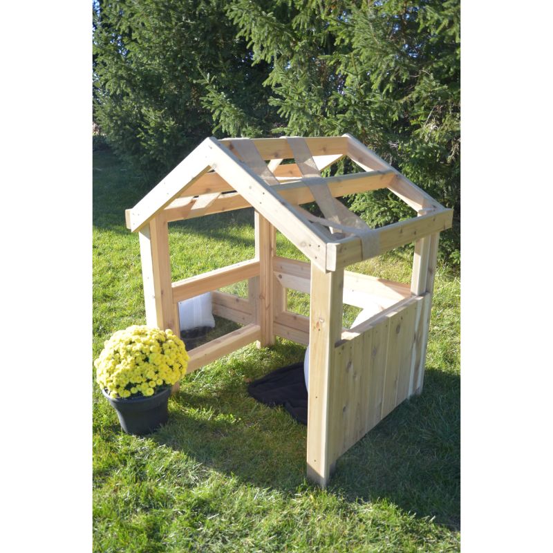 Side view of the ONP Outdoor Baby Den showing the cedar frame, open top for draping, and open front at ground level for infant crawl-through access, a natural cedar outdoor infant den for early years settings across North America