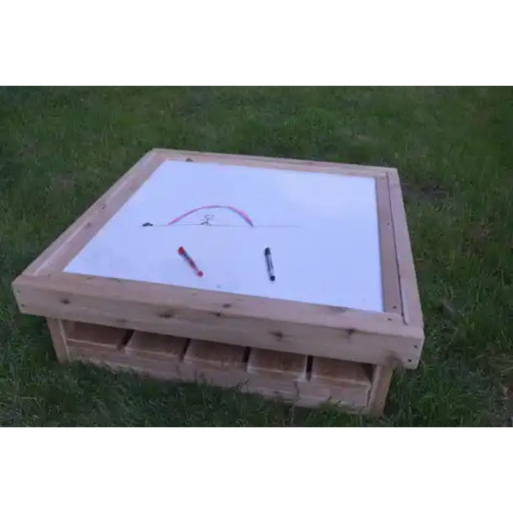 ONP Outdoor Square Art Table preschool version with drawing on the white dry-erase surface, demonstrating outdoor mark making and creative play for early years classrooms and backyards