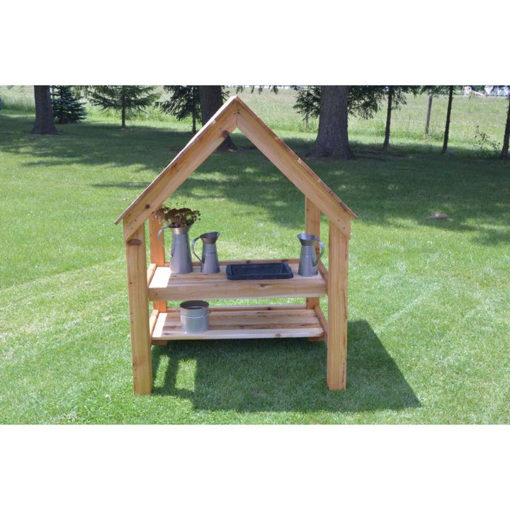 ONP Toddler Mud Kitchen in solid Western Red Cedar showing the three-sided pitched roof enclosure, designed for outdoor sensory play and early years settings