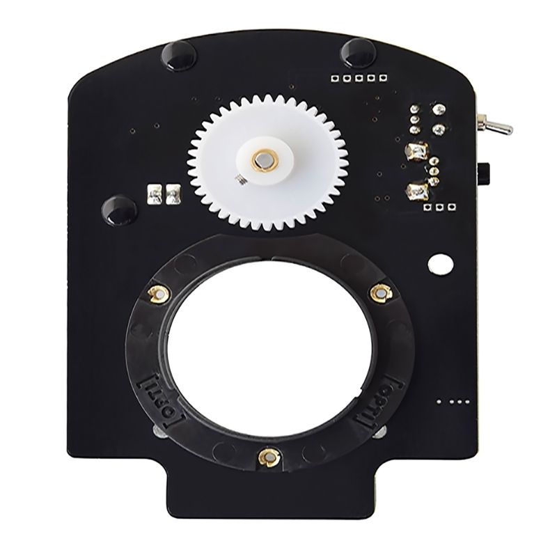 OPTIKinetics 50mm Variable Speed Active Gate Cassette Rotator close-up view showing the gear-driven cassette mount, speed dial, and direction toggle switch controls
