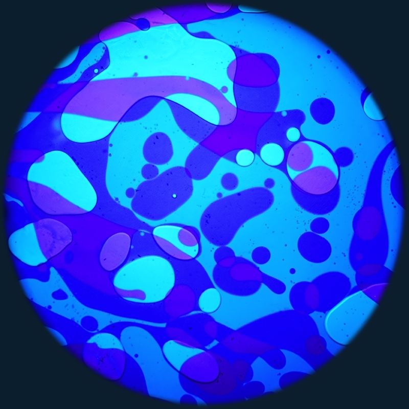 OPTIKinetics 6 inch Liquid Effect Wheel Blue Moon displaying its blue-toned oil projection effect for serene visual stimulation in multi-sensory environments and therapy rooms