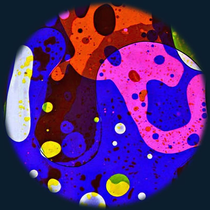 OPTIKinetics 6 inch Liquid Effect Wheel Mystical Night displaying its rich green and red oil projection effect for calming visual stimulation in sensory and therapeutic environments