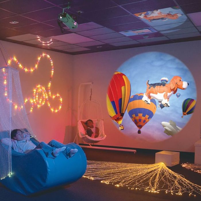 OPTIKinetics Solar 250 LED projector displaying a dog picture effect wheel projection, demonstrating the crisp image clarity and bright 4,000K white light output of the 85mm lens
