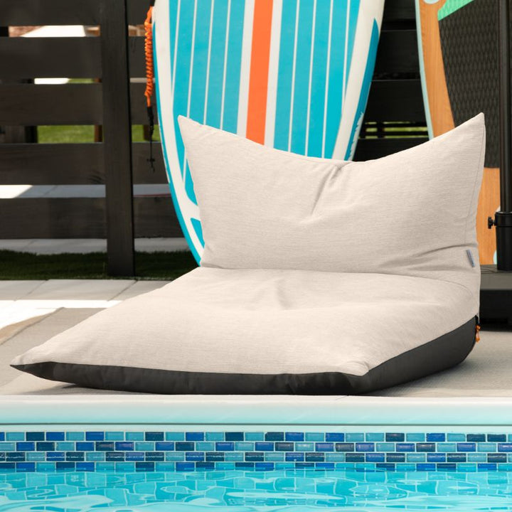 Jaxx Finster outdoor bean bag chair in Flax Sunbrella fabric, poolside
