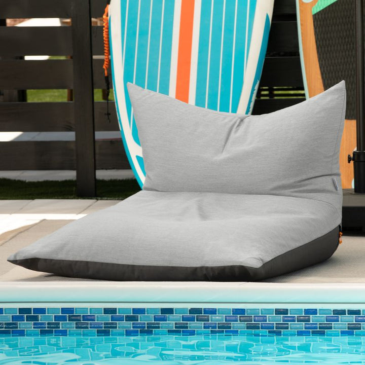Jaxx Finster outdoor bean bag chair in Granite Sunbrella fabric, poolside