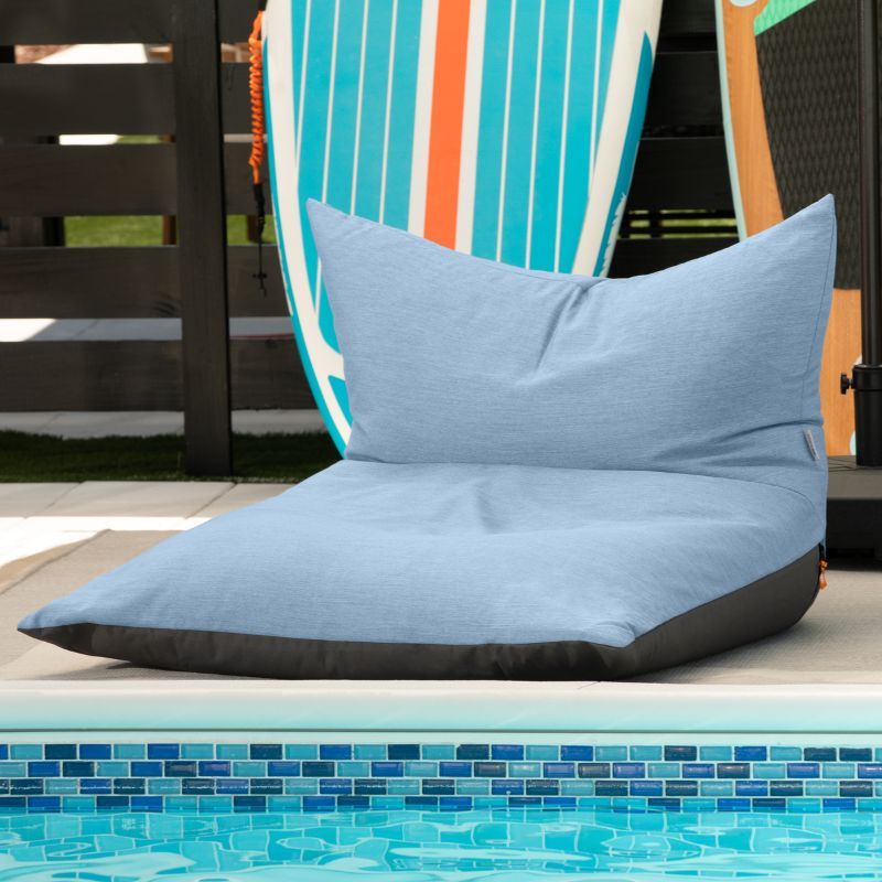 Jaxx Finster outdoor bean bag chair in Ocean Blue Sunbrella fabric, poolside