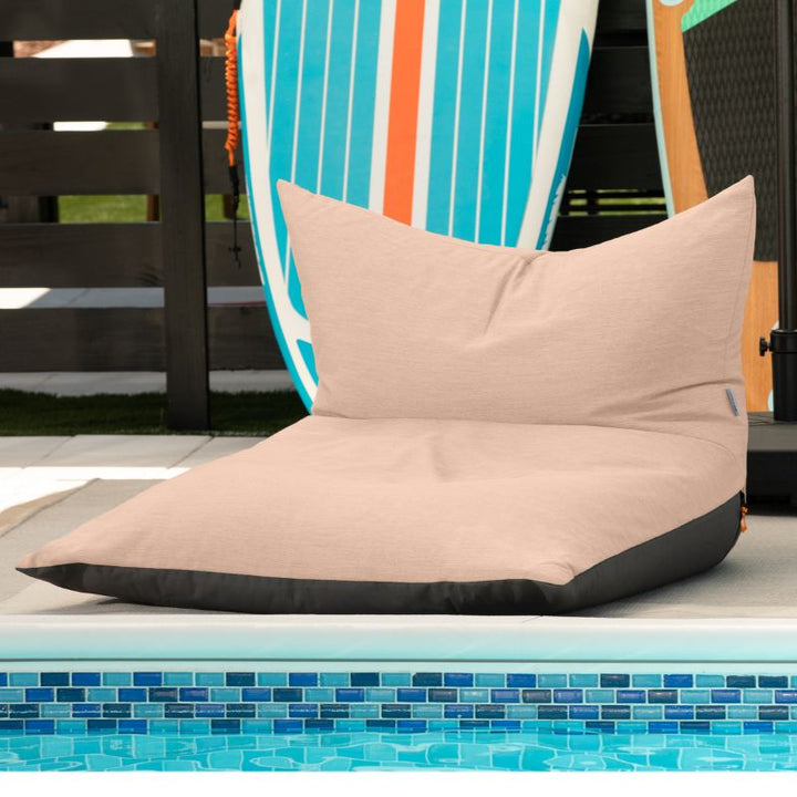 Jaxx Finster outdoor bean bag chair in Petal Sunbrella fabric, poolside