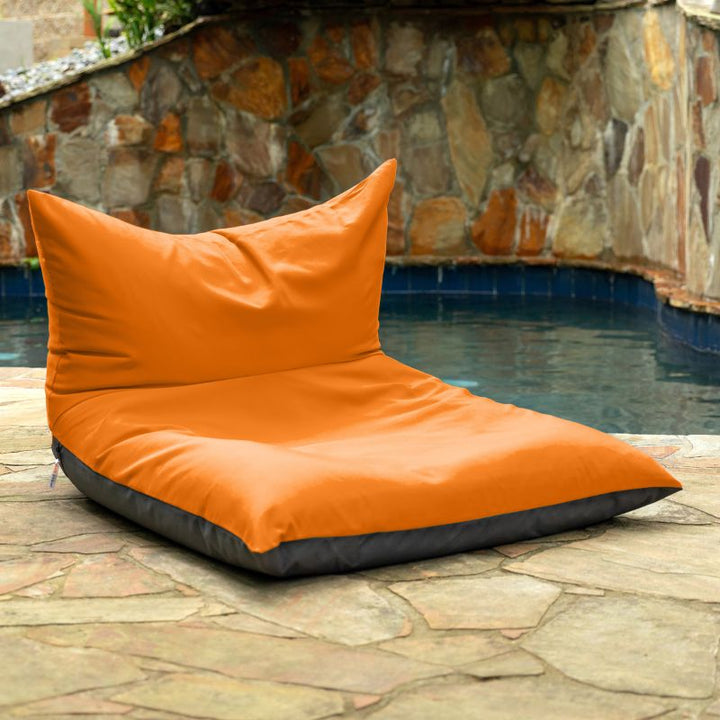 Jaxx Finster outdoor bean bag chair in Tangerine Sunbrella fabric, poolside