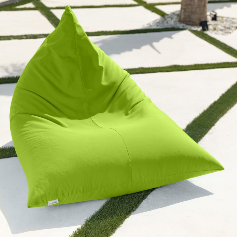 Lime green Jaxx Twist Outdoor Bean Bag Chair sitting on a sunny patio, highlighting the low-profile lounge shape of this weather-resistant outdoor seat