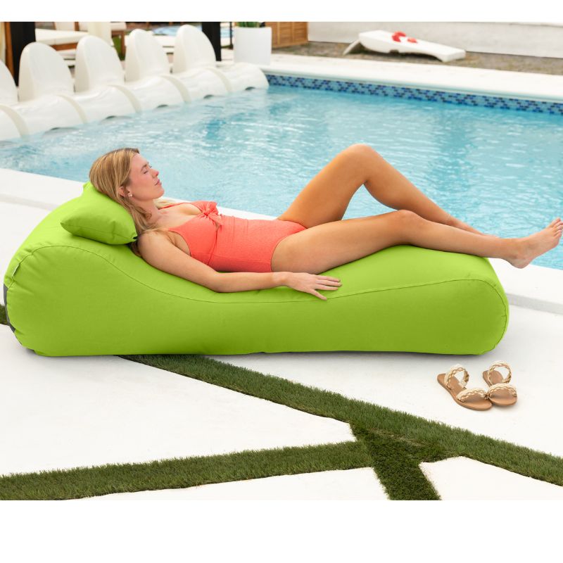 Jaxx Arlo outdoor bean bag lounger in Lime Sunbrella fabric styled poolside for bold, sunny relaxation