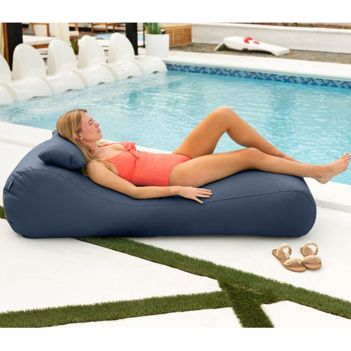 Jaxx Arlo outdoor bean bag lounger in Navy Sunbrella fabric styled poolside for bold, sunny relaxation