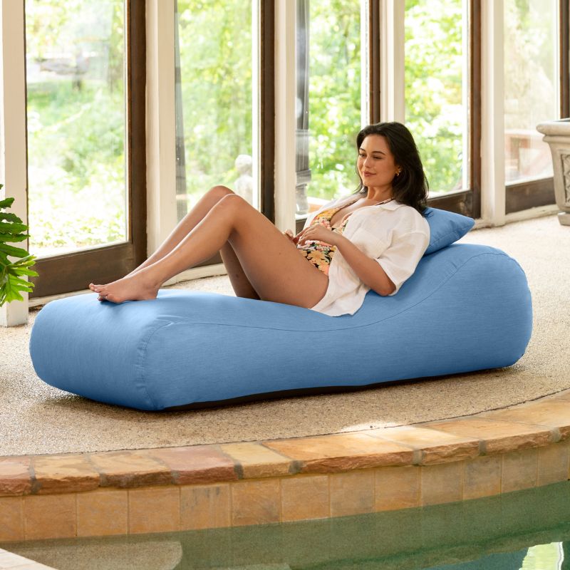 Jaxx Arlo outdoor bean bag lounger in ocean Sunbrella fabric styled poolside for calming outdoor relaxation