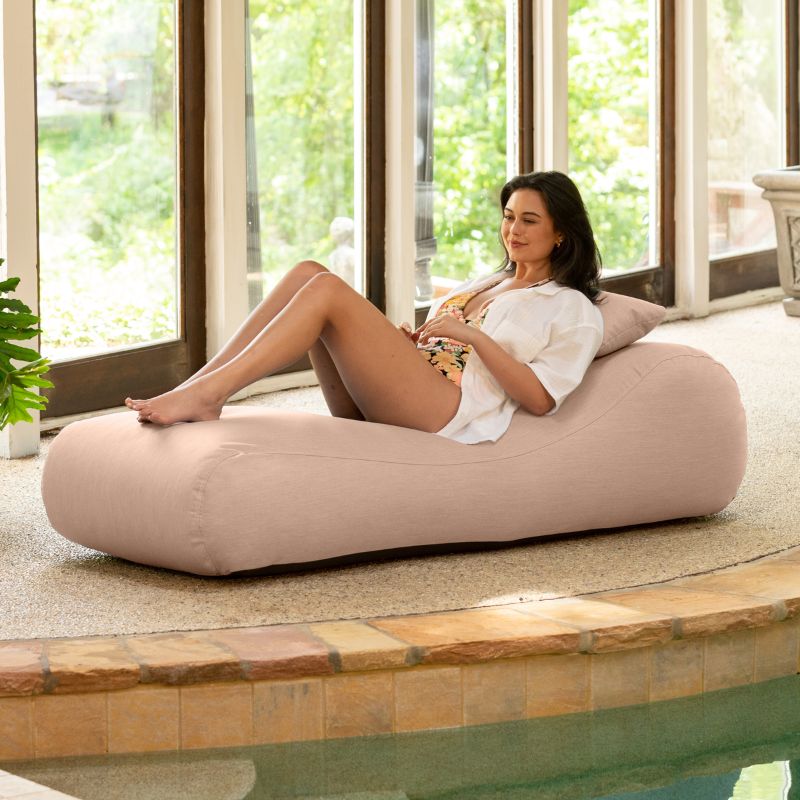 Jaxx Arlo outdoor bean bag lounger in Petal Sunbrella fabric styled poolside for soft, relaxed comfort