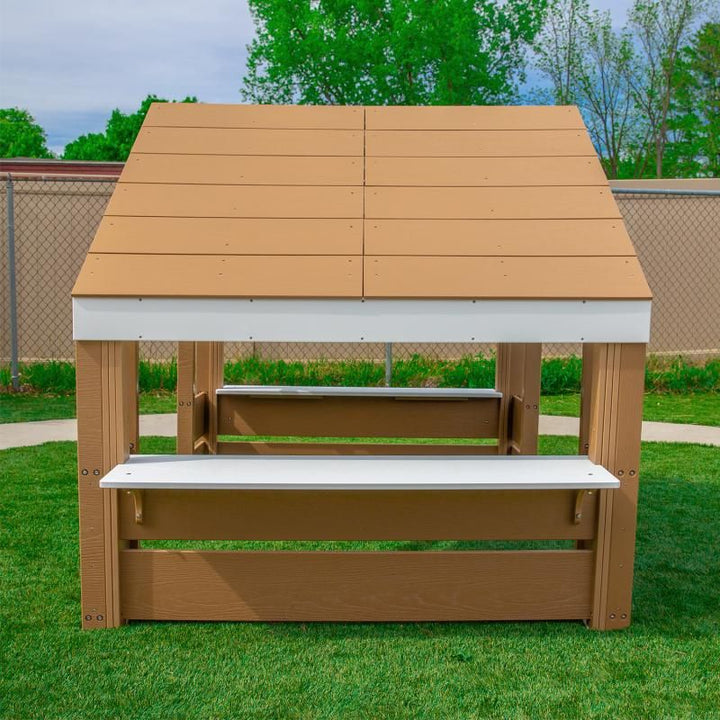 Side view of the Whitney Brothers outdoorED Learning Pavilion showing both overhanging activity tables, perfect for a nature classroom or outdoor learning space