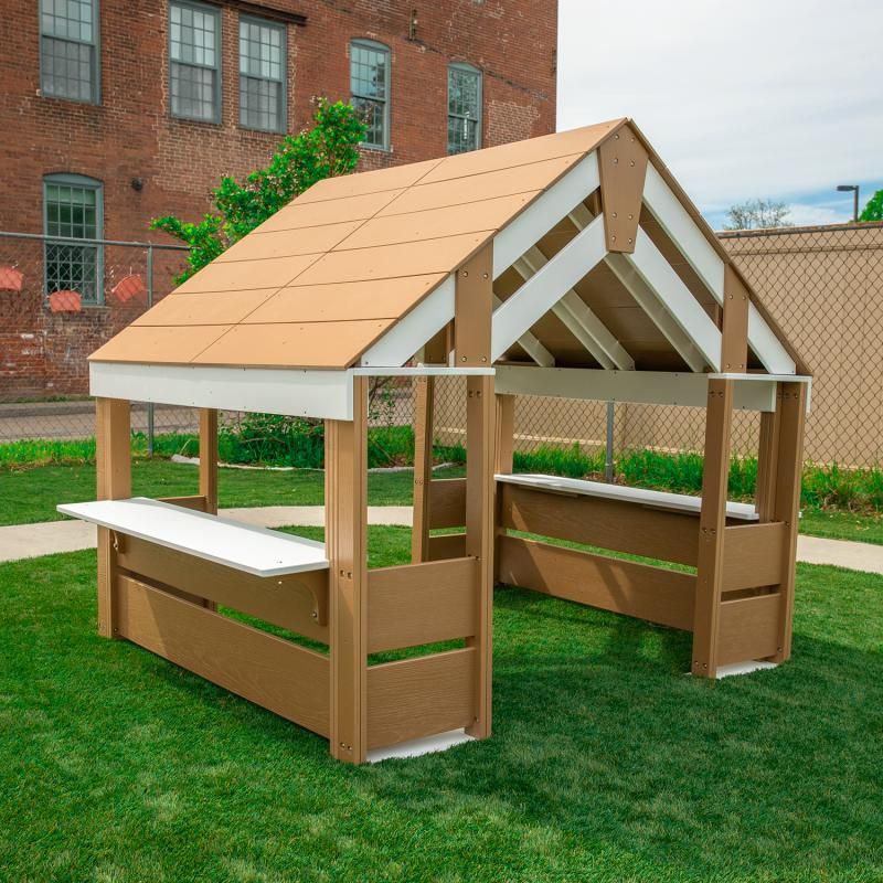 Whitney Brothers outdoorED Learning Pavilion on a grassy lawn with a wide ADA-accessible end opening and activity tables on both sides, an inclusive outdoor classroom pavilion