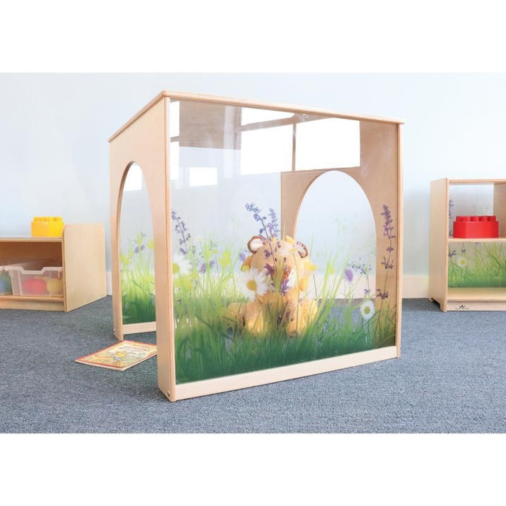 Plush toy and picture book at the Whitney Brothers Nature View Play House Cube in a preschool classroom, a see-through quiet space with easy adult supervision