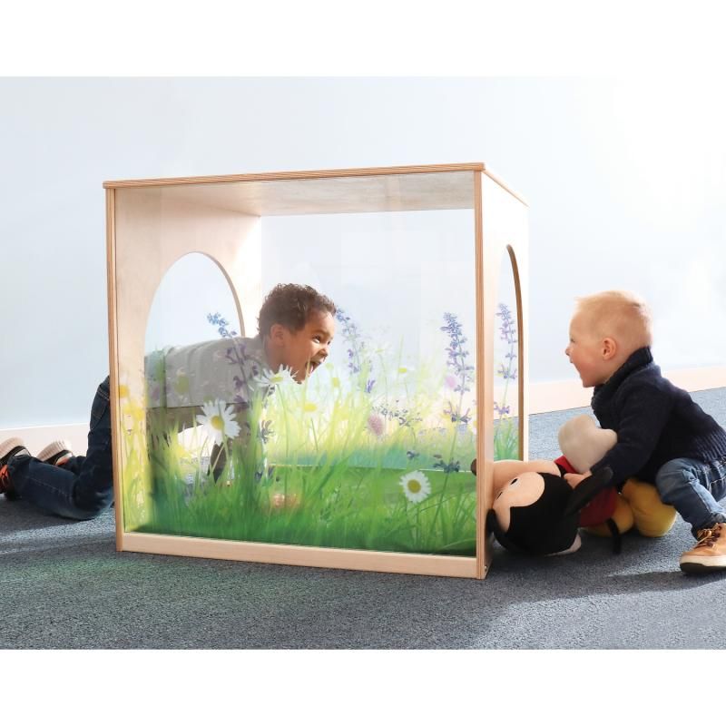 Two toddlers laughing through the wildflower acrylic wall of the Whitney Brothers Nature View Play House Cube, a playhouse cube and calm corner for early learning