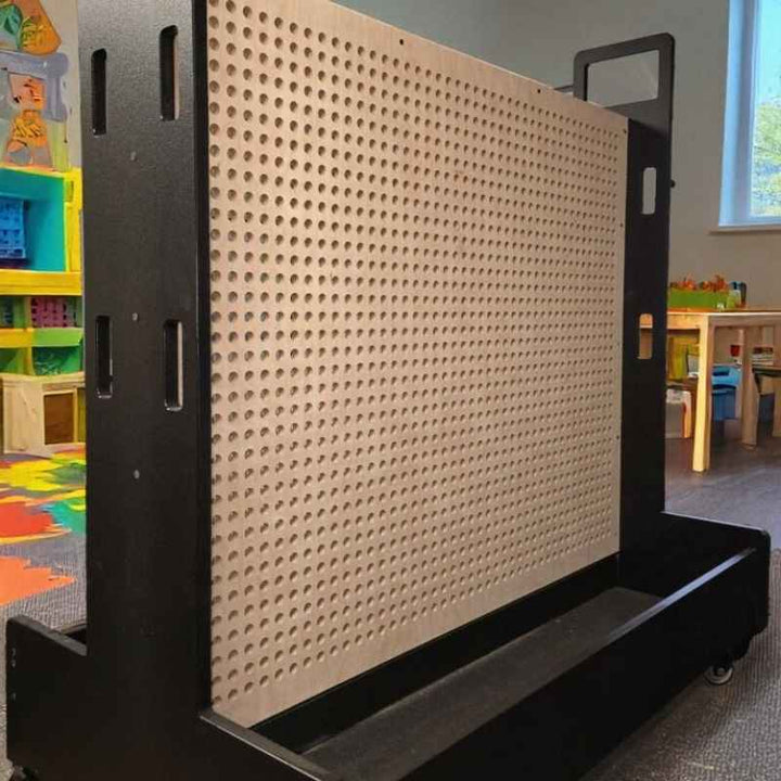 KidWorx Portable Playland Cart with an empty pegboard play surface, a mobile STEM cart shown in a classroom setting