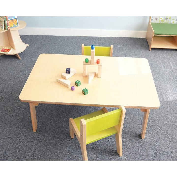 Overhead view of the 18 inch Whitney Plus Rectangle Table by Whitney Brothers, a preschool rectangle table set up as a classroom activity table with blocks