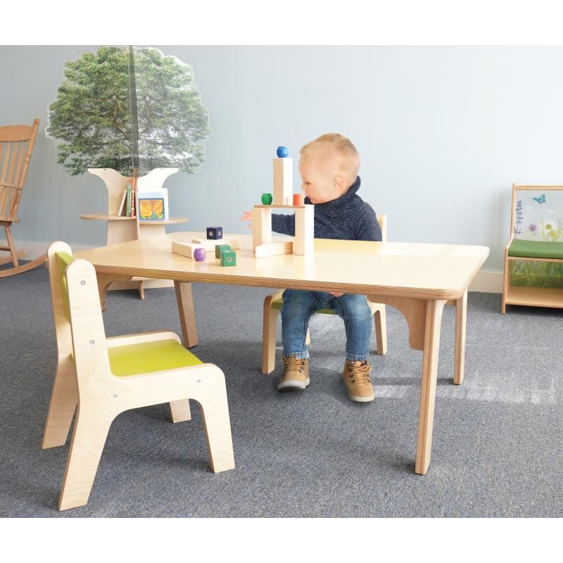 Toddler building a block tower at the 18 inch Whitney Plus Rectangle Table from Whitney Brothers, a right-sized daycare table for hands-on play