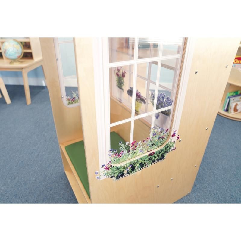 Close-up of the shatterproof acrylic side window with window box flowers on the Whitney Brothers Nature View Window Seat, a quiet space reading nook in an early learning classroom