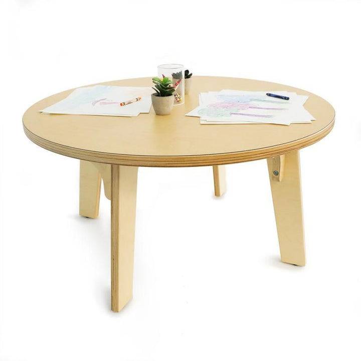 Crayon drawings and small potted plants on the Whitney Brothers Whitney Plus Round Table, an 18 inch round activity table for art and fine motor play