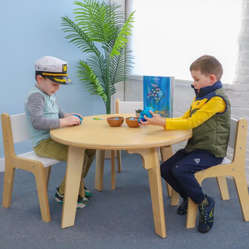 Two children shaping modeling dough at the Whitney Brothers Whitney Plus Round Table, a 22 inch round classroom table that supports fine motor and social play