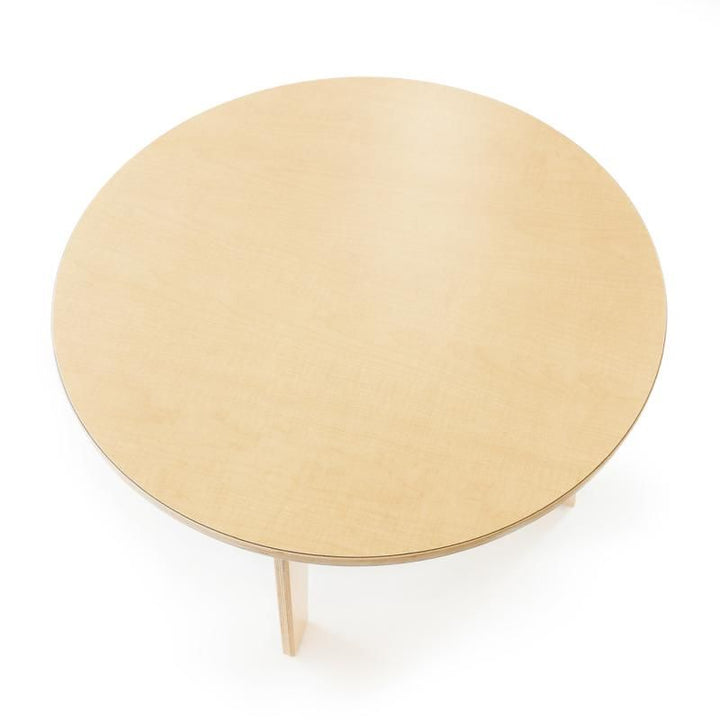 Top-down view of the 35 inch maple laminate surface on the Whitney Brothers Whitney Plus Round Table, a 22 inch round classroom table