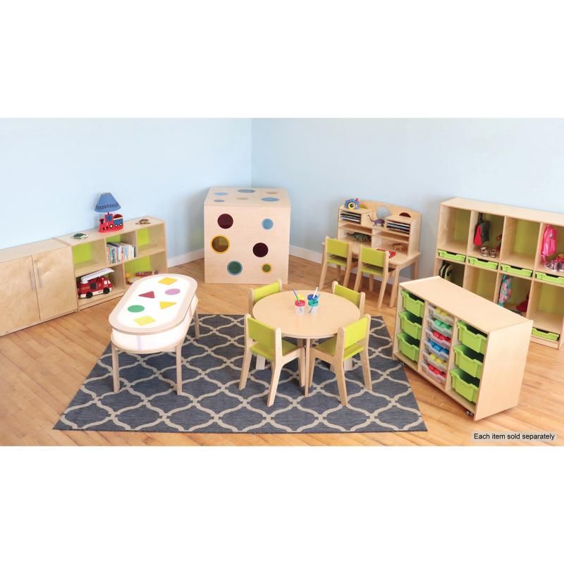 Whitney Brothers Whitney Plus Round Table with four green children's chairs in a preschool classroom, a round classroom table surrounded by birch storage and learning furniture