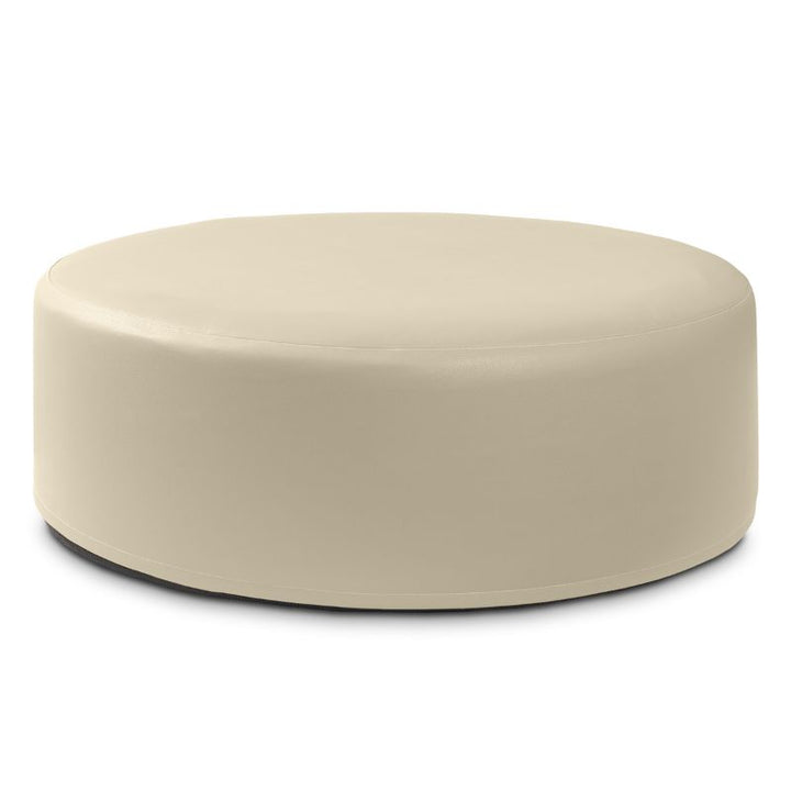 Jaxx Candler round ottoman in cream beige, flexible foam seating for classrooms and libraries