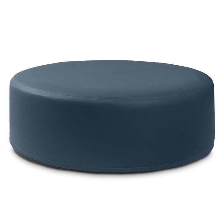 Jaxx Candler round ottoman in dark navy, flexible foam seating for classrooms and libraries