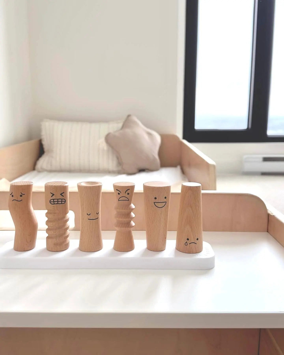 Second lifestyle view of the Sapiens Child Apple Montessori floor bed with rails in a toddler bedroom, demonstrating the low-profile floor-level sleeping environment