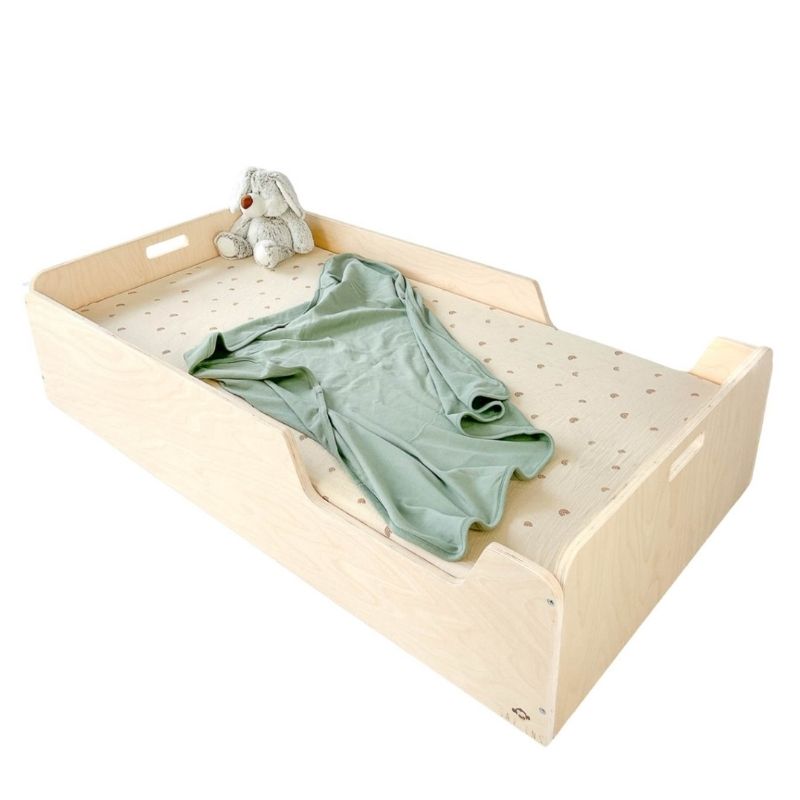 Sapiens Child Apple Montessori floor bed with rails in a clean landscape view showing the low-profile design, protective borders, and eco-friendly plywood construction made in Vancouver