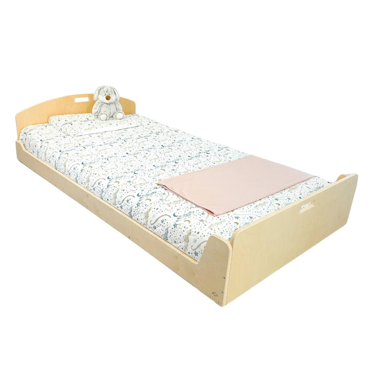 Sapiens Child Cherry Montessori floor bed shelf-free variant in Birch plywood finish, landscape view showing the natural wood grain and minimal open-frame design