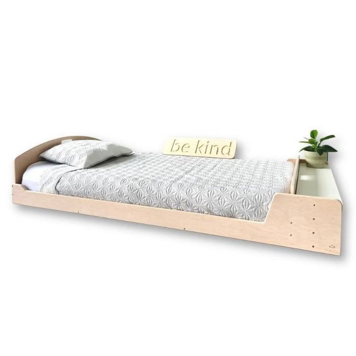 Clean profile view of the Sapiens Child Cherry Twin Montessori floor bed showing the minimal eco-friendly plywood design and slatted base for mattress airflow
