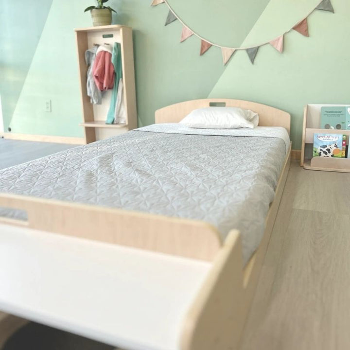 Third landscape view of the Sapiens Child Cherry Twin Montessori floor bed highlighting the open frame construction and Vancouver plywood craftsmanship