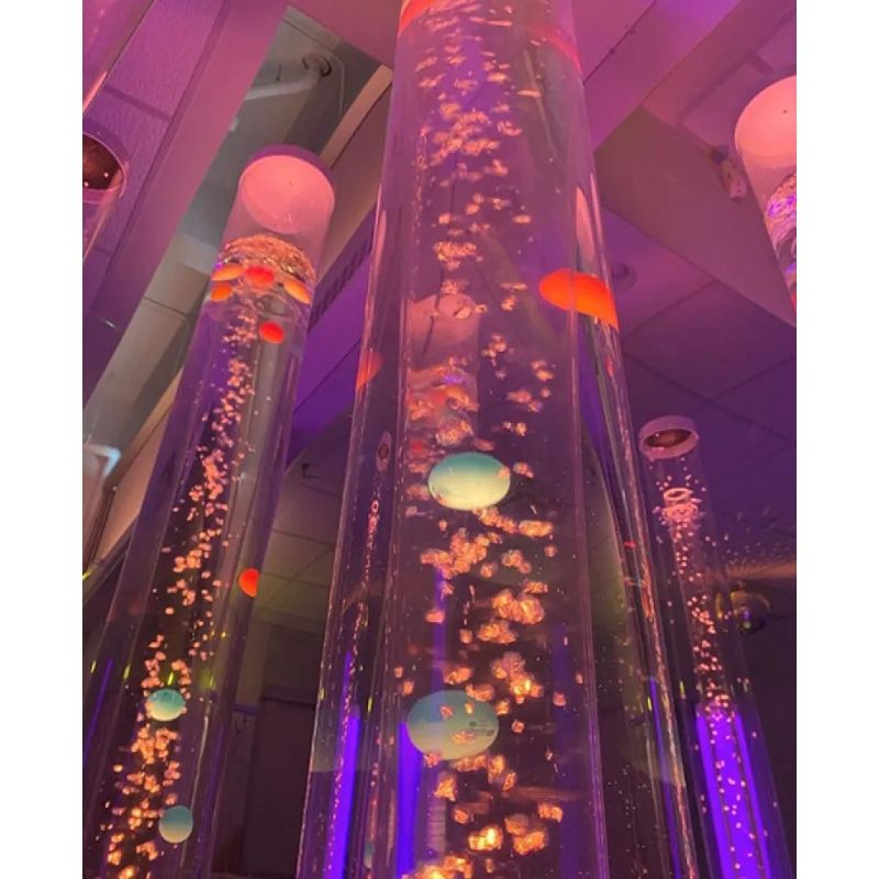Close-up of TFH Interactive LED Bubble Tubes with rising bubbles and floating coloured balls, a calming LED bubble tube for visual sensory stimulation