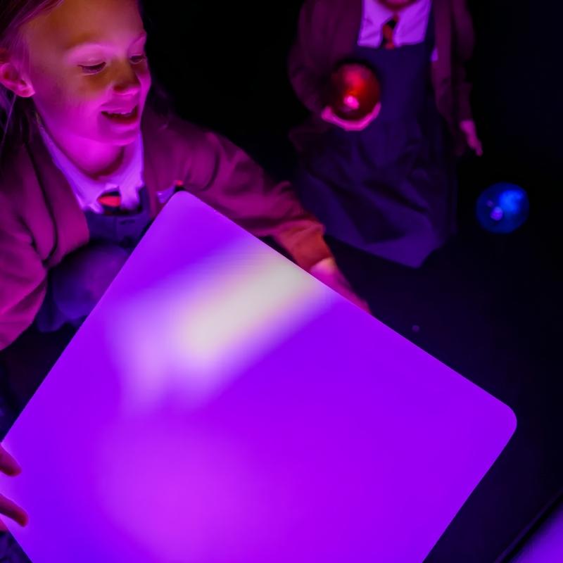 TFH Mood Dice sensory mood cube glowing purple while children explore colour changing light together in a classroom sensory space