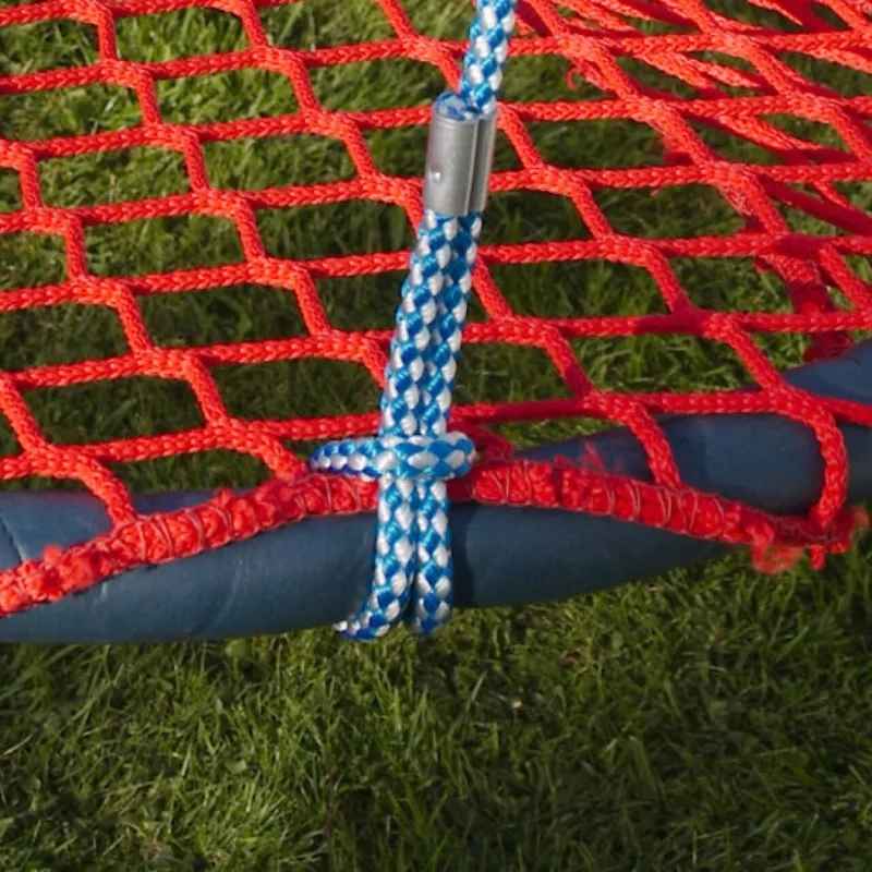 Close-up of the TFH Nest Swing's rope and hardware attachment point, showing the adjustable rope connecting to the basket frame