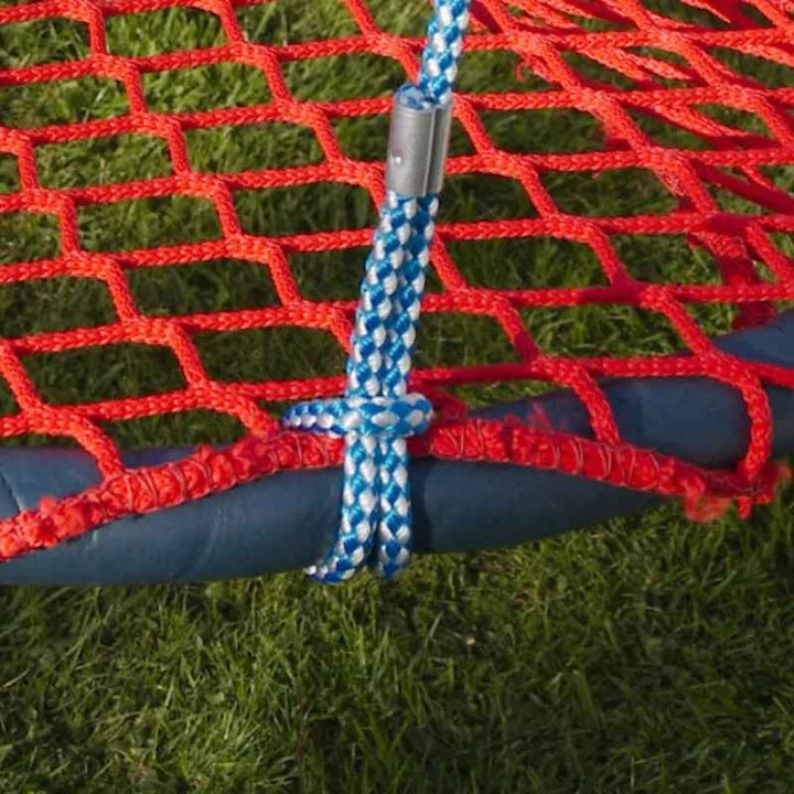 Close-up of the TFH Nest Swing's rope and hardware attachment point, showing the adjustable rope connecting to the basket frame