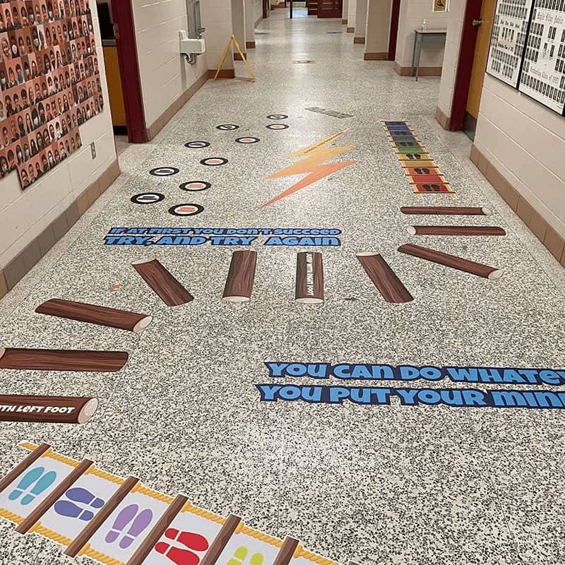 Sensory Paths Xtreme Obstacle full path installed in a school hallway, showing the complete agility circuit layout with speed ladder and tyre drill floor decals