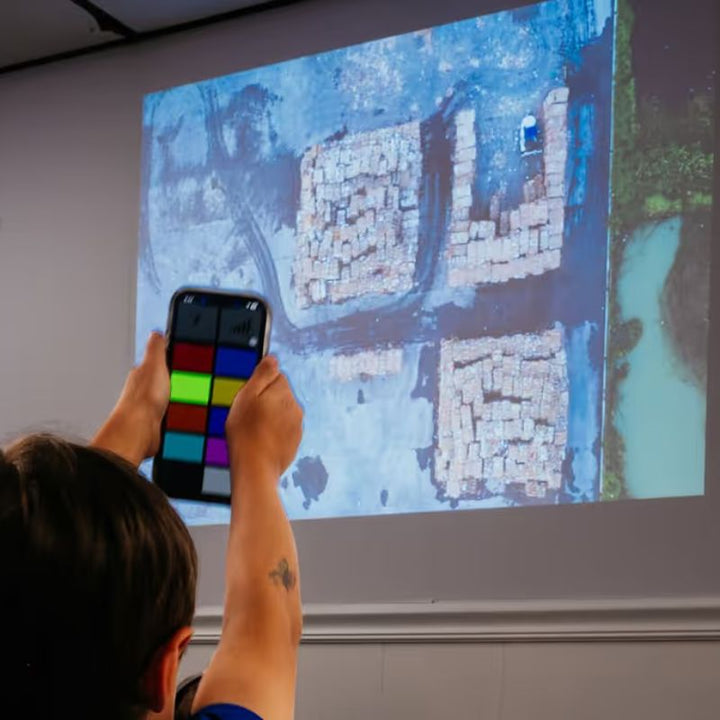 TFH ChromaTheme construction theme video projected in a classroom while a student controls playback with the app