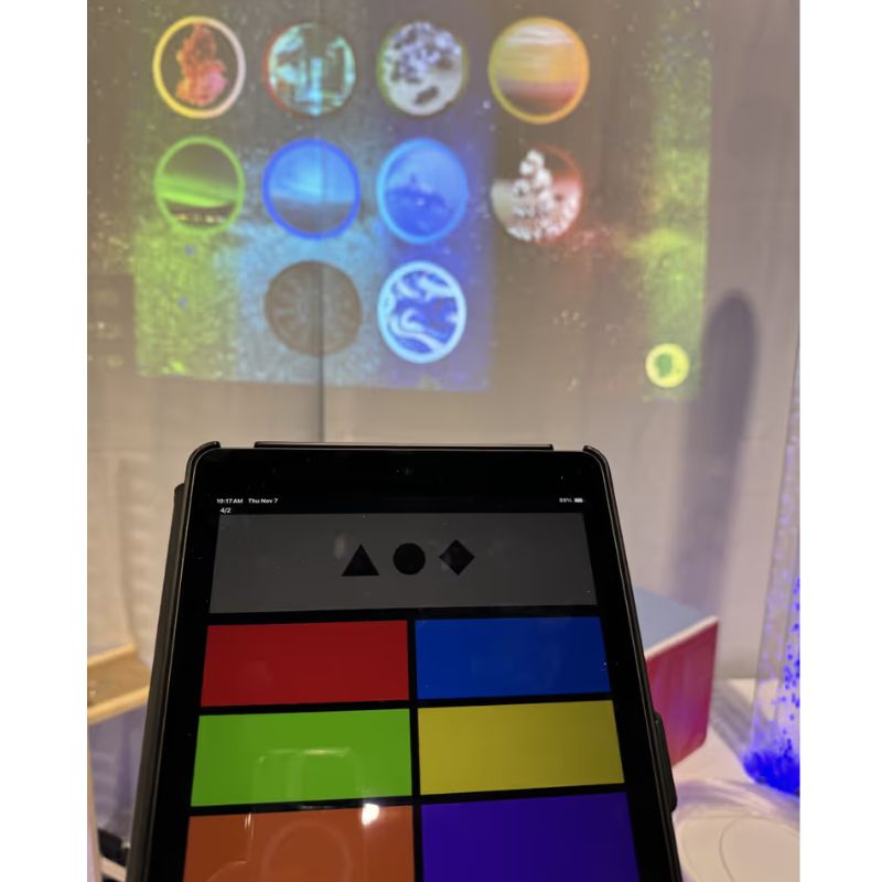 TFH ChromaTheme theme selector menu on the MSE Genie app with the ten colour coded video themes displayed on a sensory room wall