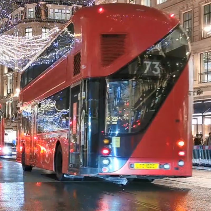 Red double decker bus video still from the transportation theme in the TFH ChromaTheme sensory video library