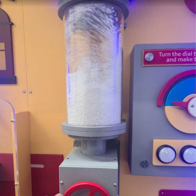 LiteZilla Hurricane Tube sensory wind tube in motion, showing foam beads swirling upward in a storm-like effect inside the acrylic column