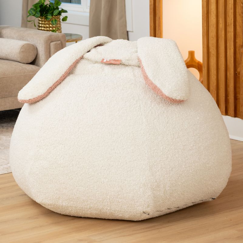 Raven-Symoné HopSeat sherpa bean bag chair in Cloud, a low-angle view showing the bunny-ear detail and deep-pressure comfort